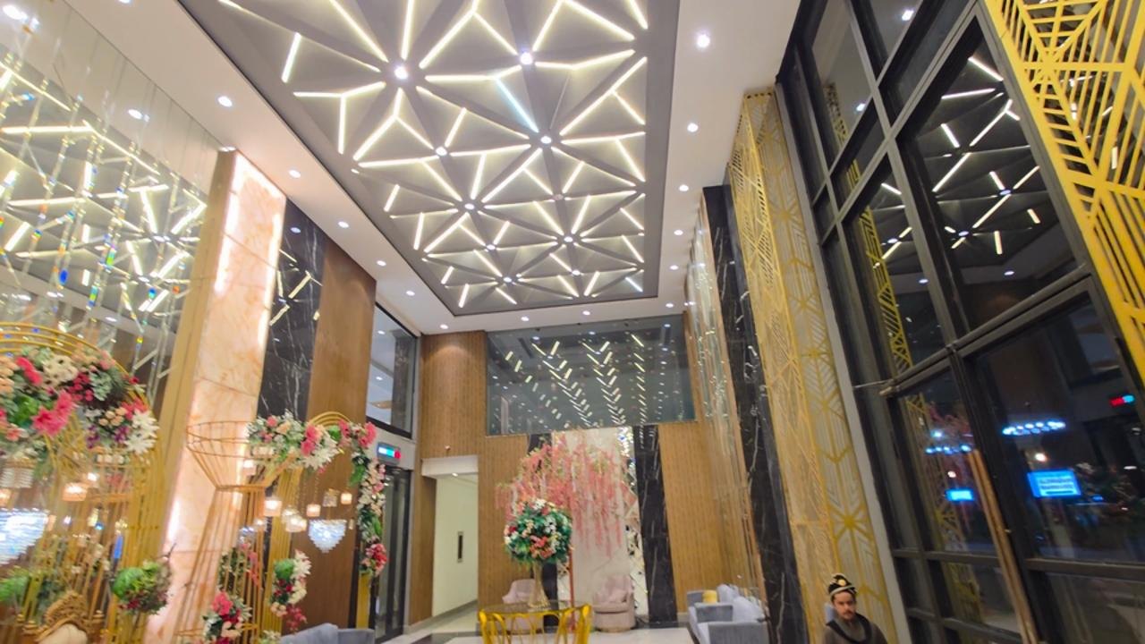 Empire entrance with geometric ceiling lights